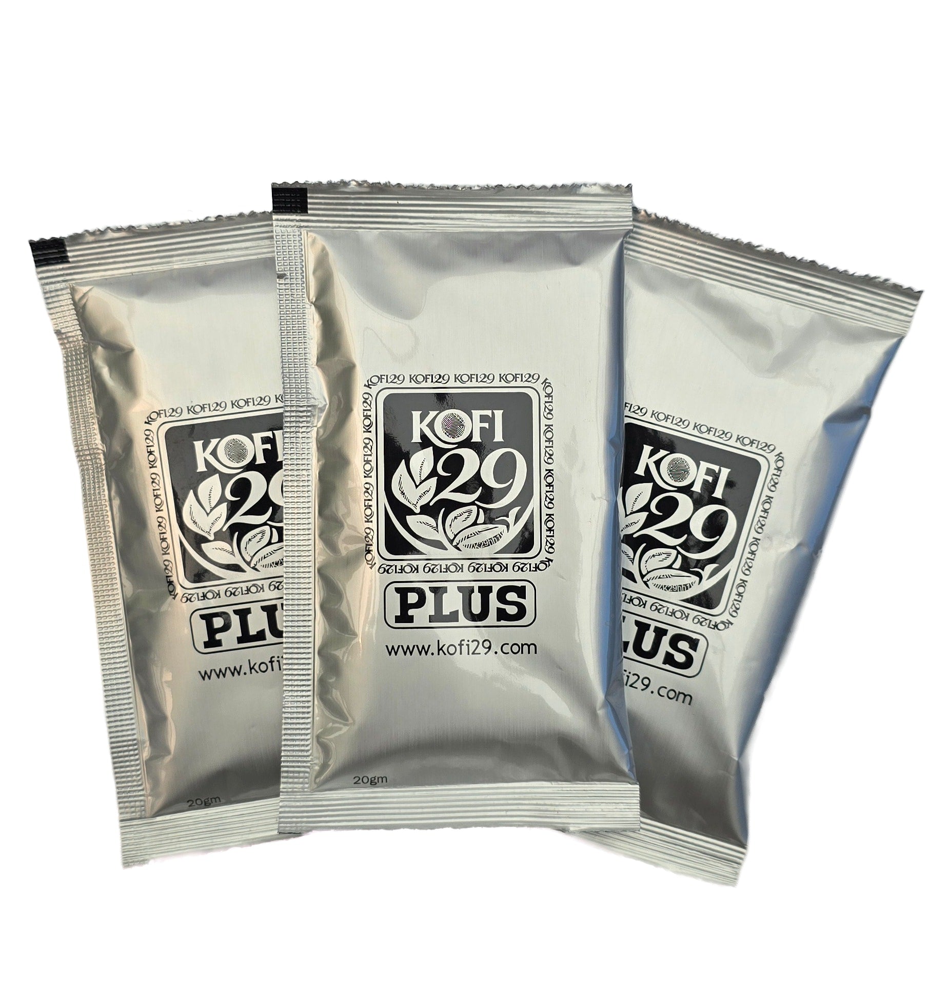 Three silver Kofi 29 Plus 20g sachets fanned out — natural botanical performance coffee